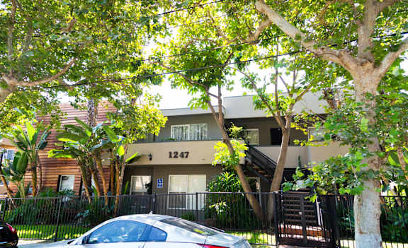 Entrance with car and trees