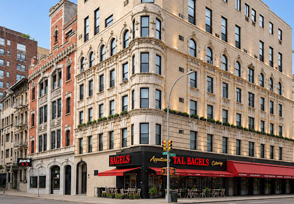 A tall building with a Talbots store on the ground floor.