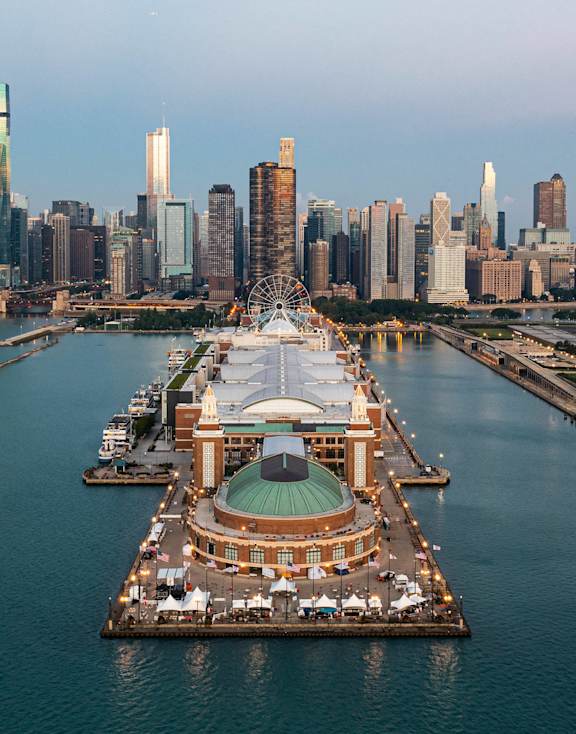 A city skyline with a large body of water in front of it.