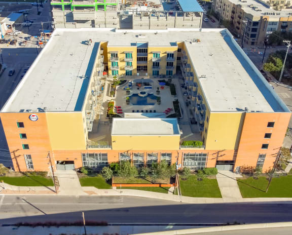 an aerial view of a building with orange and yellow walls