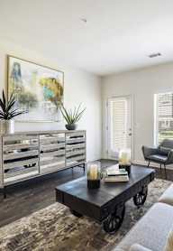 a kitchen with wooden cabinets and stainless steel appliances at The Maddox Apartments, Centerton, AR