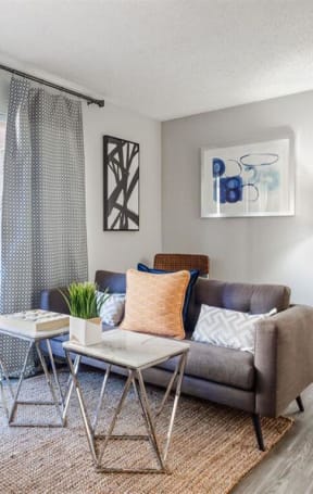a living room with a couch and a table at Parc Medallion LLC, Union City California