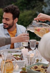 a group of people sitting around a table drinking wine at Glen at Burnsville, Minnesota, 55337