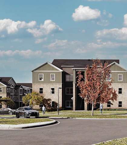 A row of houses with cars parked in front. at Sage at Franklin Park Apartment , Austin, 78744