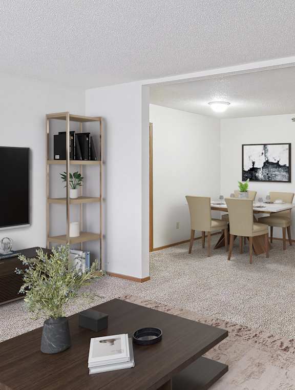 A living room with a white couch, a brown coffee table, and a flat screen TV.