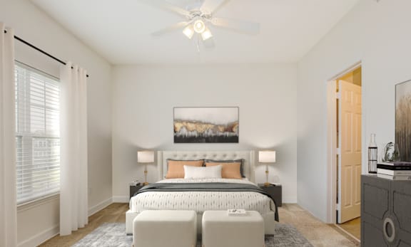 a bedroom with a bed and a ceiling fan