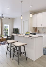 an open kitchen and living room with an island and stools