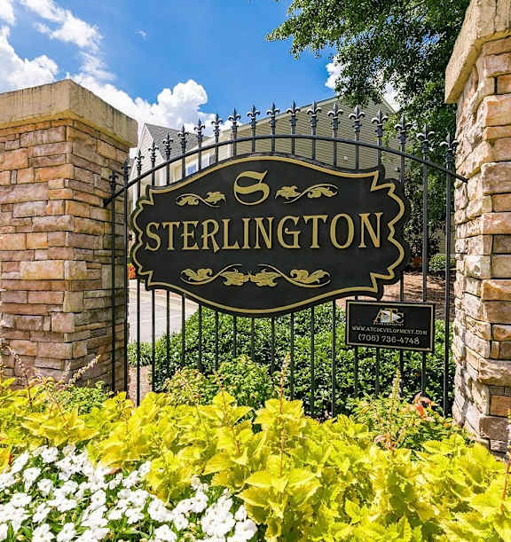 a living room with a large window and a couch and chairs at Sterlington Apartments, Grovetown, GA, 30813
