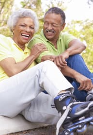 This is a photo of an older active couple roller blading.
