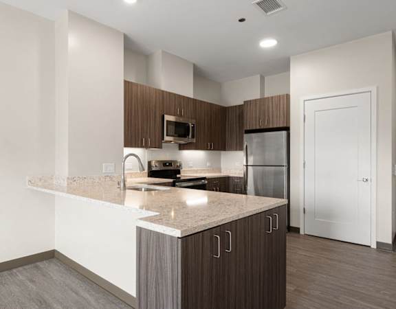 a kitchen with a granite counter top and