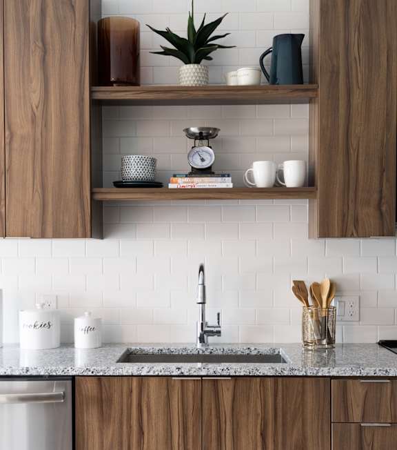 A kitchen with wooden cabinets and stainless steel appliances.
