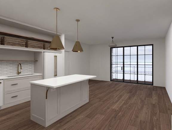 A kitchen with a white island and wooden floors.