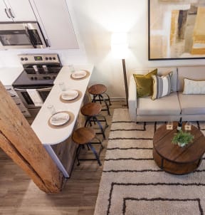 an aerial view of a living room with a couch and a table