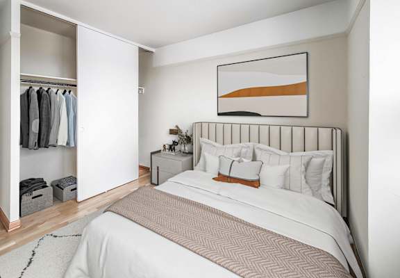 Bedroom at Buena Shores apartments in Buena Park, Chicago with natural light, built-in closet, and modern decor.