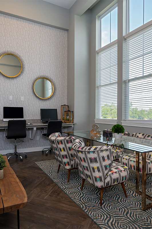 a living room with a couch and a table with chairs