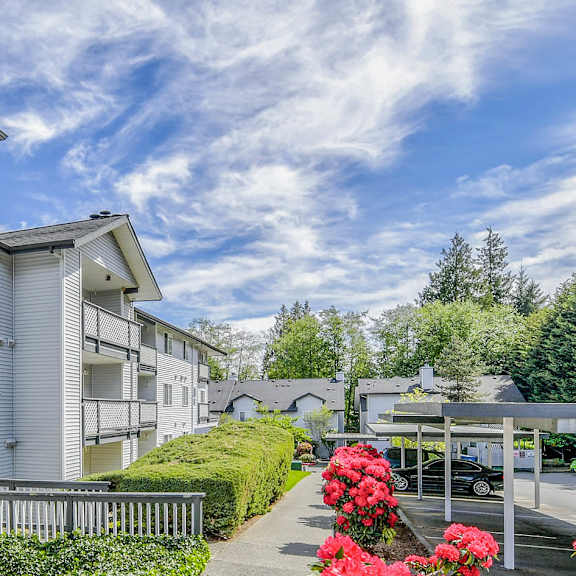 A gym with a variety of exercise equipment including treadmills, stationary bikes, and weights at Glen at North Creek, Everett, WA 98208