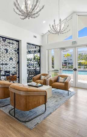 A living room with a pool view.
