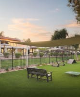 Reveal Apartments Pool with Lounge Chairs at Dusk