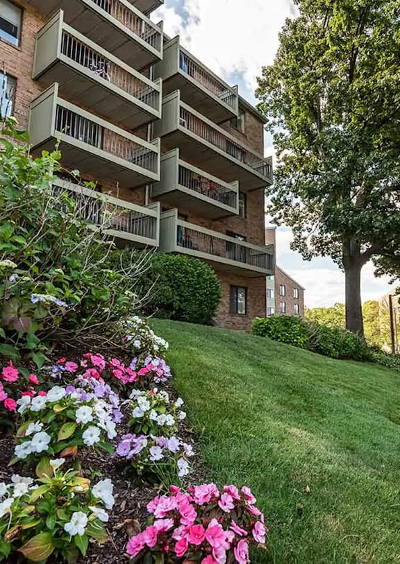 A building with a green lawn in front of it.