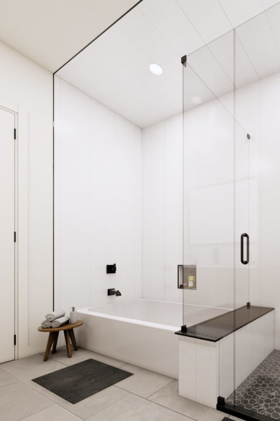a large white bathroom with a shower and a tub