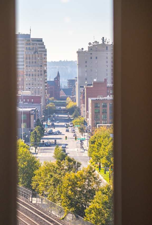 A view of a cityscape through a window.