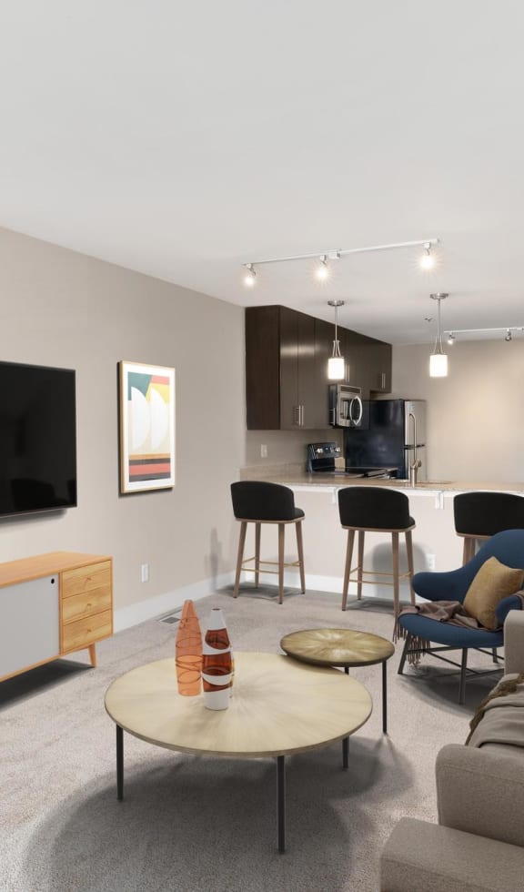 a living room filled with furniture and a flat screen tv