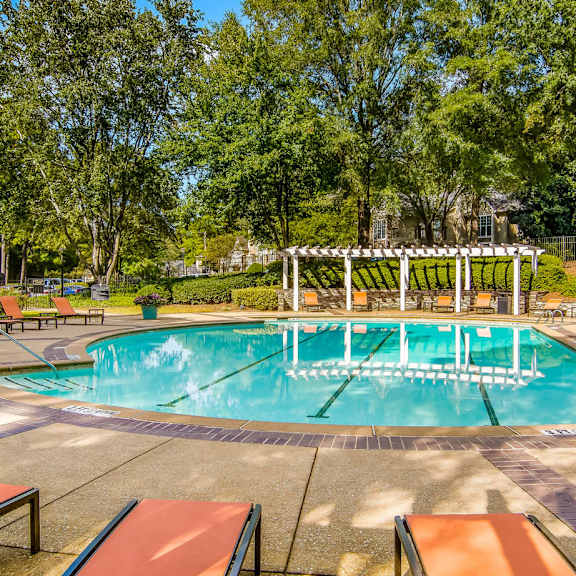A gym with a variety of exercise equipment including treadmills, stationary bikes, and weights at Wynfield Trace, Peachtree Corners, GA, 30092