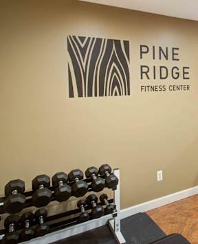 Gym with weights at Pine Ridge Apartments, Rochester Hills, MI