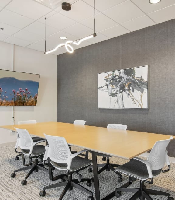 a conference room with a long table and chairs