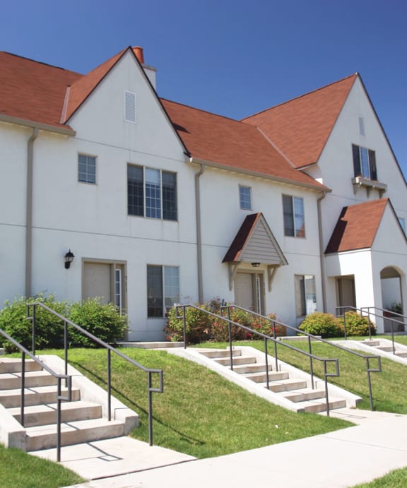 a row of townhouses on the side of a street at Heritage Park apartments and townhomes in Minneapolis, MN