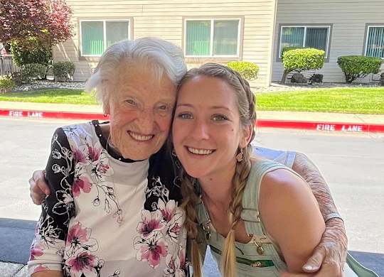 Resident with Activity Director smiling at event at River Commons Senior Living, Redding, CA, 96002