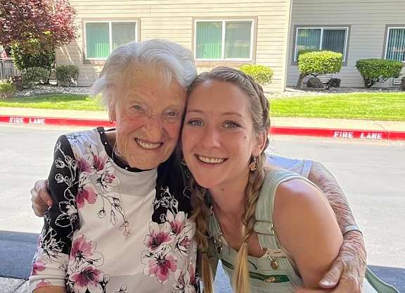 Resident with Activity Director smiling at event at River Commons Senior Living, Redding, CA, 96002
