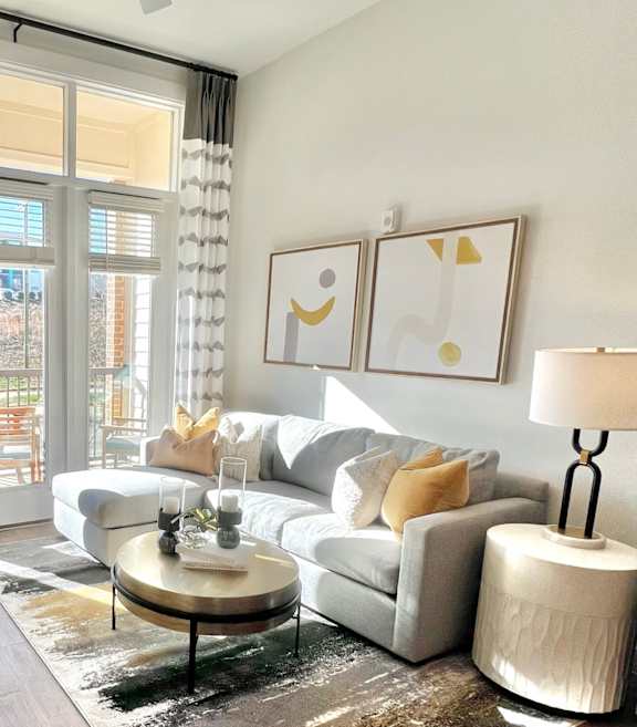 a living room with a leather couch and a coffee table