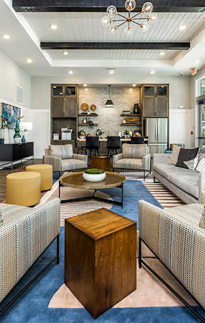 a living room and dining room with a couch and a table