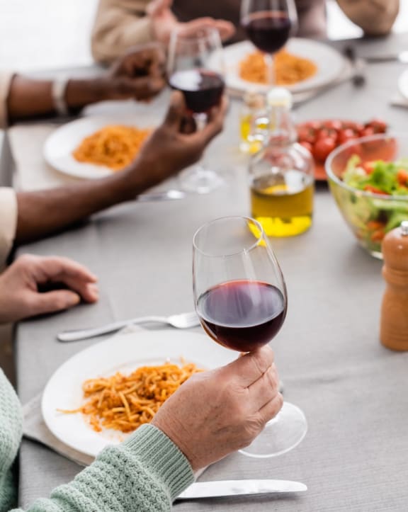 Friends Having Wine and Dinner Together