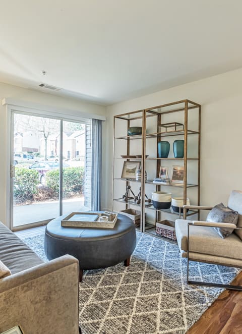 an open living room with couches and a fireplace