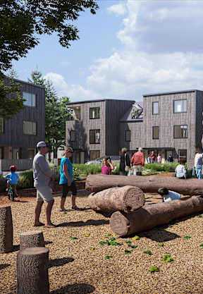 A playground with children playing and a building in the background. at The Grindstone  Apartments, Waterdown, ON