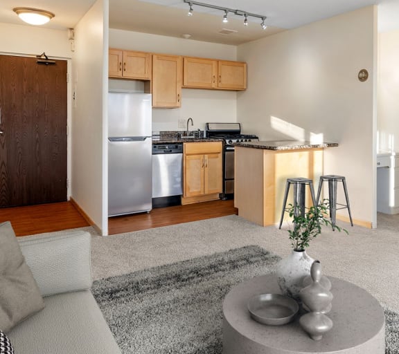 a living room with a table and chairs and a stove