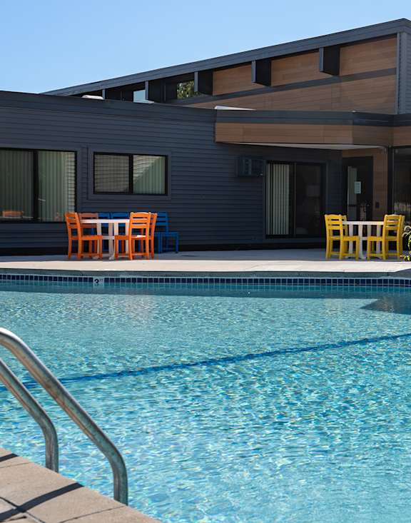 Swimming pool with a house in the background at The Bosk Apartment Homes, Woodbury