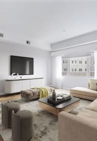 a living room filled with furniture and a flat screen tv