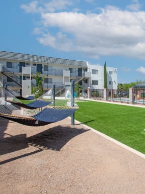 Hammock Lounge Area and Cornhole Playing Area at The Link at 4th Ave Apartments