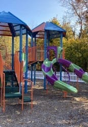 a playground with two slides and a