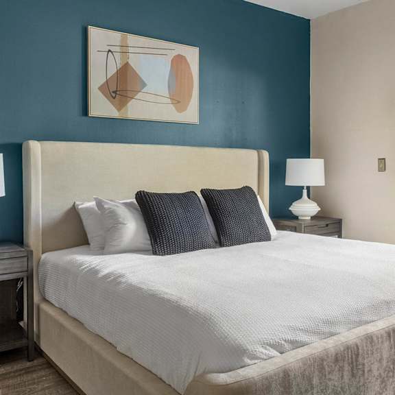 A living room with a grey couch and a coffee table.at Riverview Landing @ Valley Forge, Pennsylvania