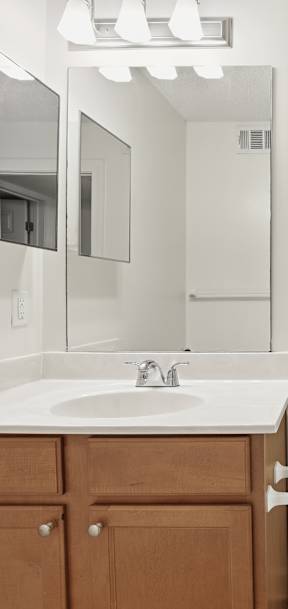 A white toilet sits next to a sink in a bathroom.