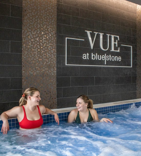 two women talking in a hot tub at Vue at Bluestone, Duluth, Minnesota