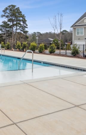 our apartments have a swimming pool with our apartment buildings in the background