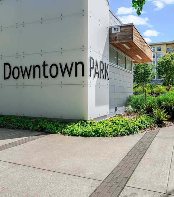A white building with the words "Downtown Park" on it.