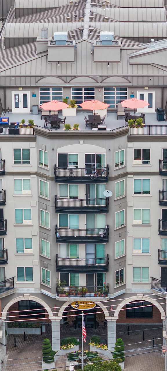 A large, multi-story building with a balcony on the second floor.
