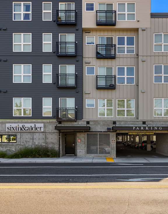 A multi-story building with a sushi restaurant on the ground floor.