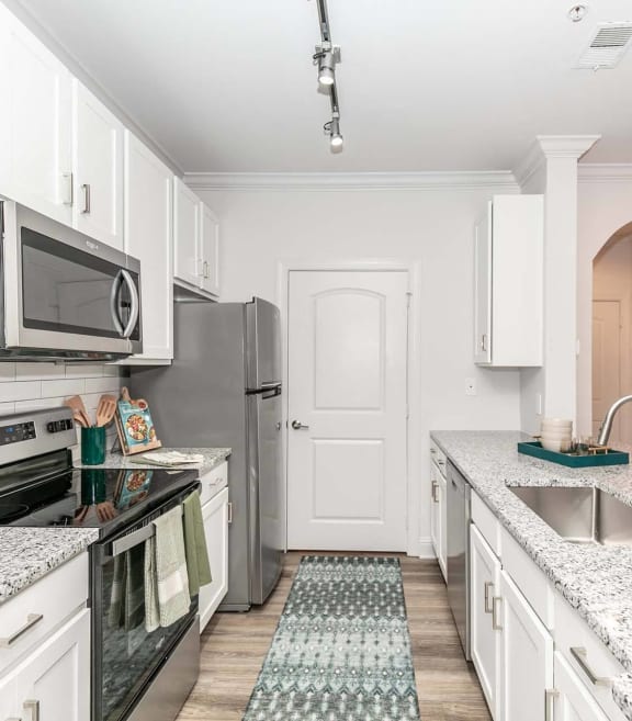 a kitchen with a counter top and a sink